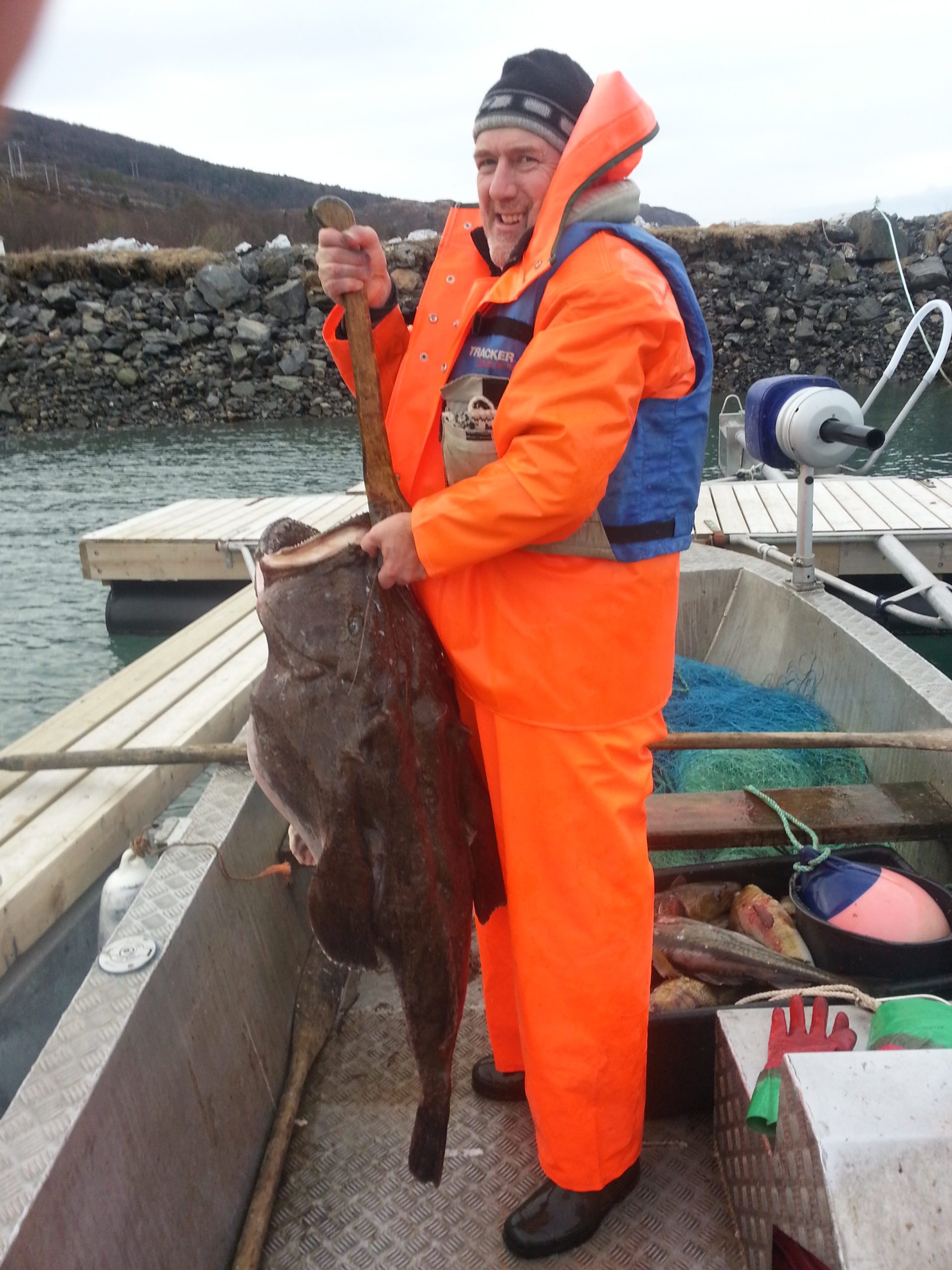 Proprietor holding fish